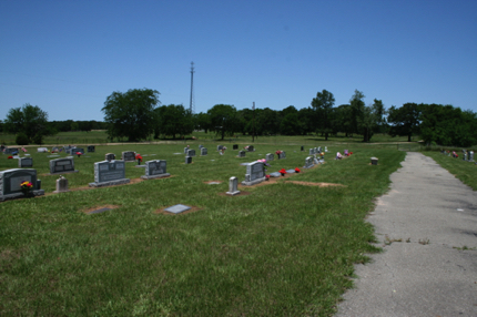 West side of cemetery and cemetery road from entry gate
