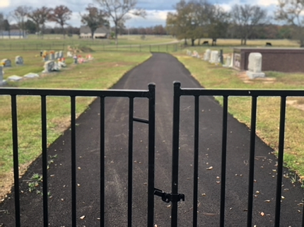 New wrought iron entry gates and pavement. New wrought iron entry gates and pavement.