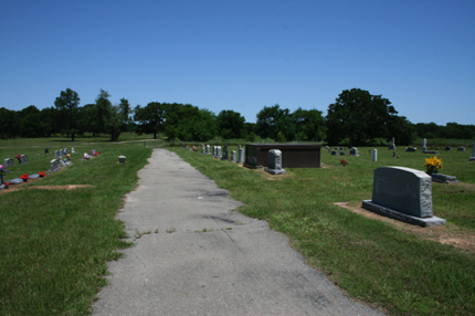 Cemetery road viewed north from entry gate Cemetery road viewed north from entry gate